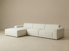 Angled view of the Solis modular sectional sofa showing the deep seating and textured beige linen fabric.