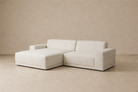 Perspective view of the Solis beige modular sectional sofa highlighting the wide armrests and plush cushioning.