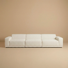Beige sofa against a matching beige wall