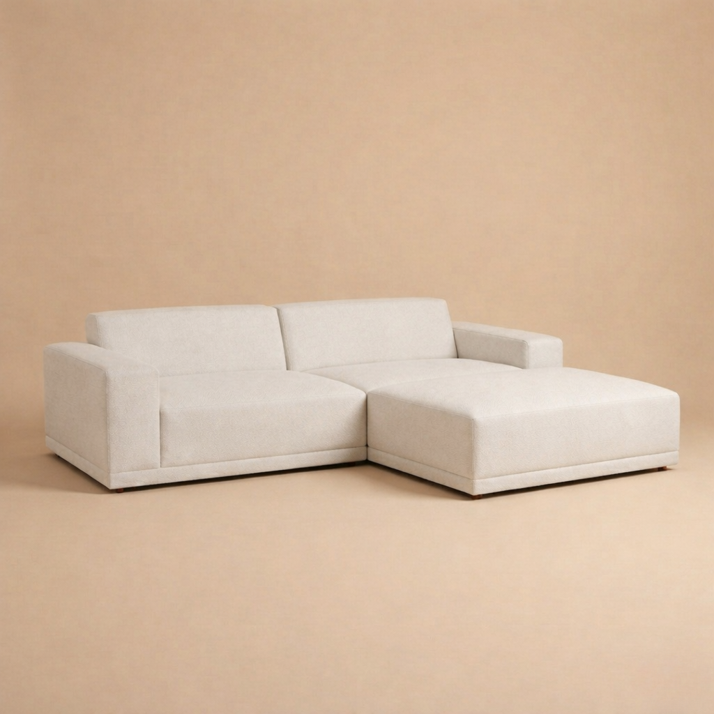 Beige sectional sofa on a beige background