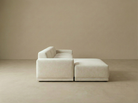 Solis modular sofa shown from a clean side profile highlighting the chaise configuration in a minimal studio setting