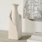 Terra Ridge Ceramic Vase displayed on wooden surface beside abstract wall art