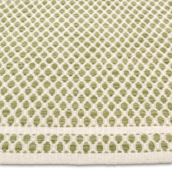 Detailed close-up of the chunky geometric honeycomb weave on the sage green and cream Theo hand-woven wool rug.