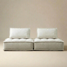 Light linen sofa with white cushions on a beige background