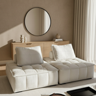Tofu Modular Sofa in beige suede fabric styled in minimalist modern living room with oak sideboard, round mirror, and neutral decor