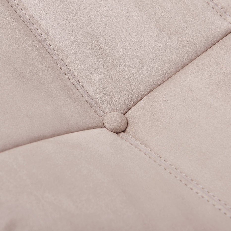 Macro detail shot of the button tufting and soft fabric texture on the TOGO Lounger.