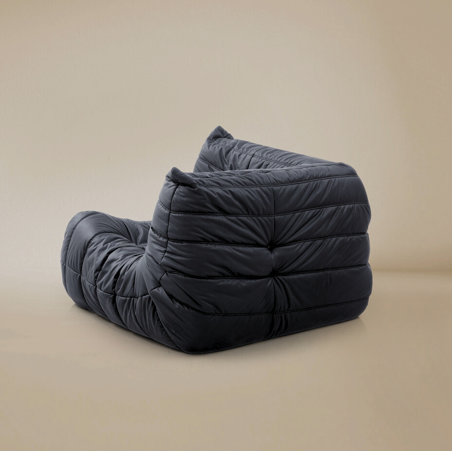 Back view of the TOGO corner unit showing the fully upholstered finish for open floor plan placement.