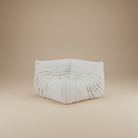 TOGO Lounger corner seat unit in white fabric featuring pleated design for modular sectional configuration.