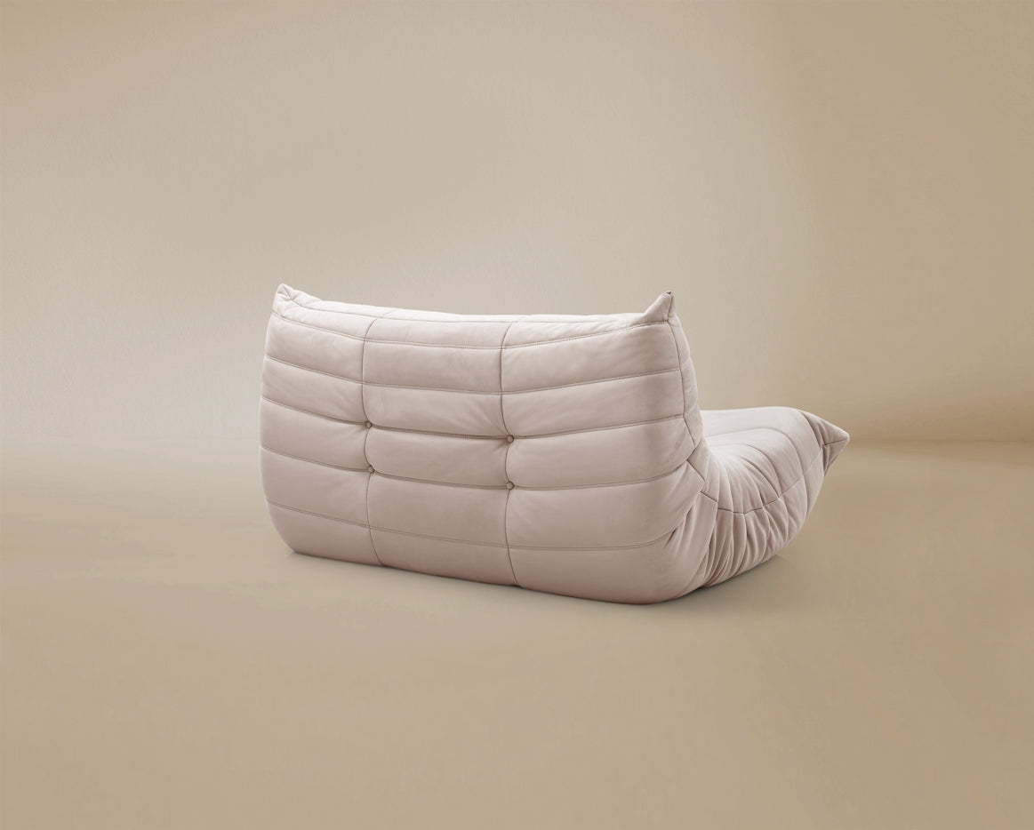 Back view of the TOGO Lounger showing the fully upholstered finish and low profile silhouette.