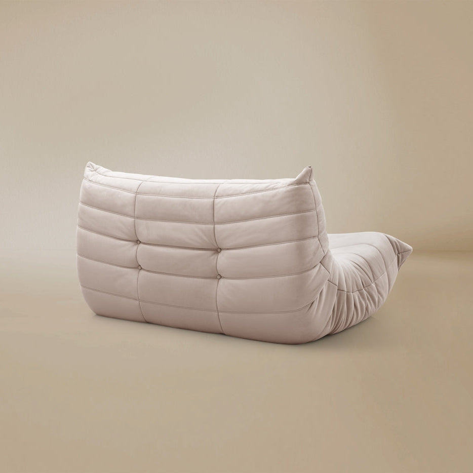 Back view of the TOGO Lounger showing the fully upholstered finish and low profile silhouette.