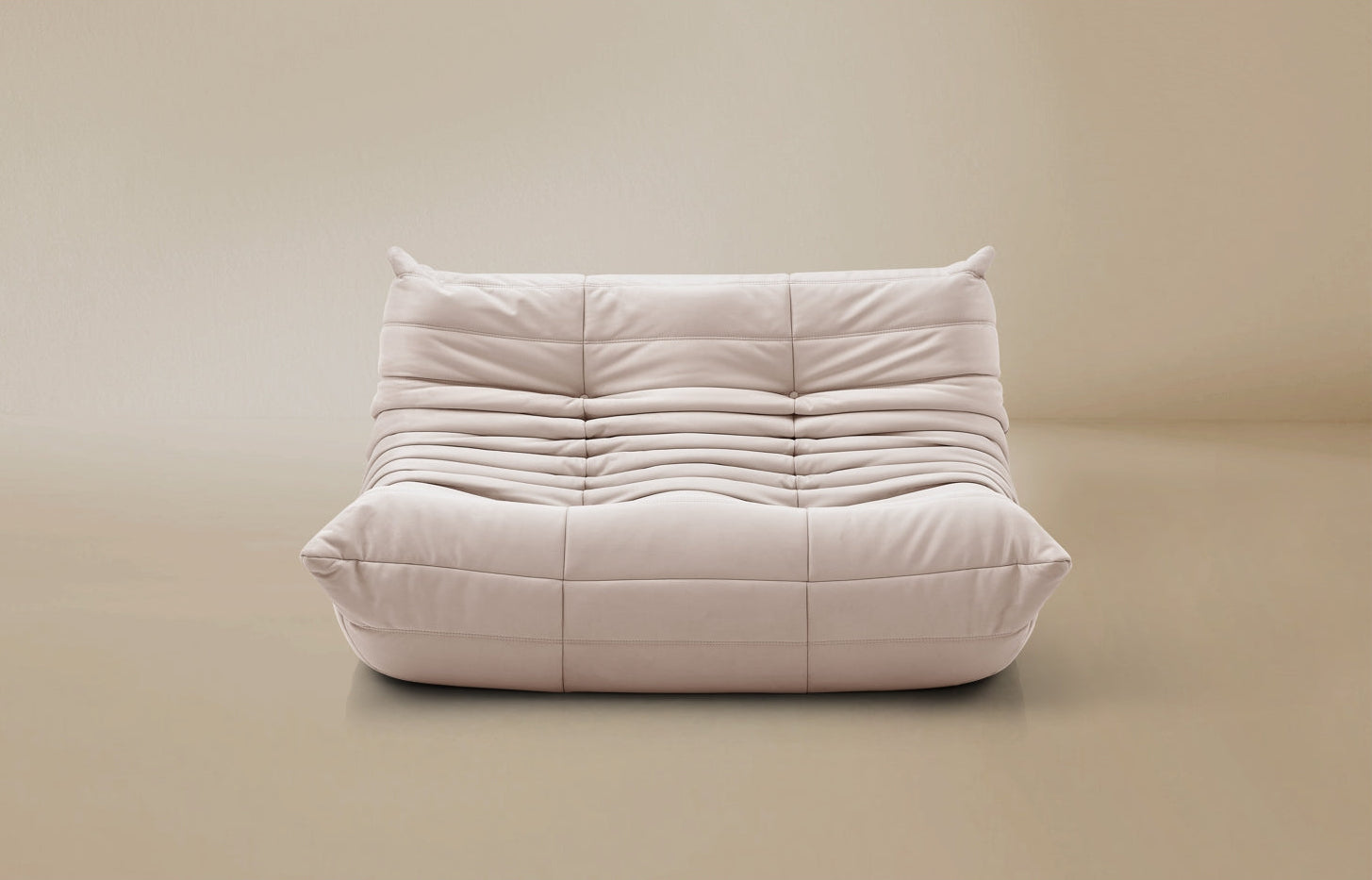 White cushioned chair on a beige background