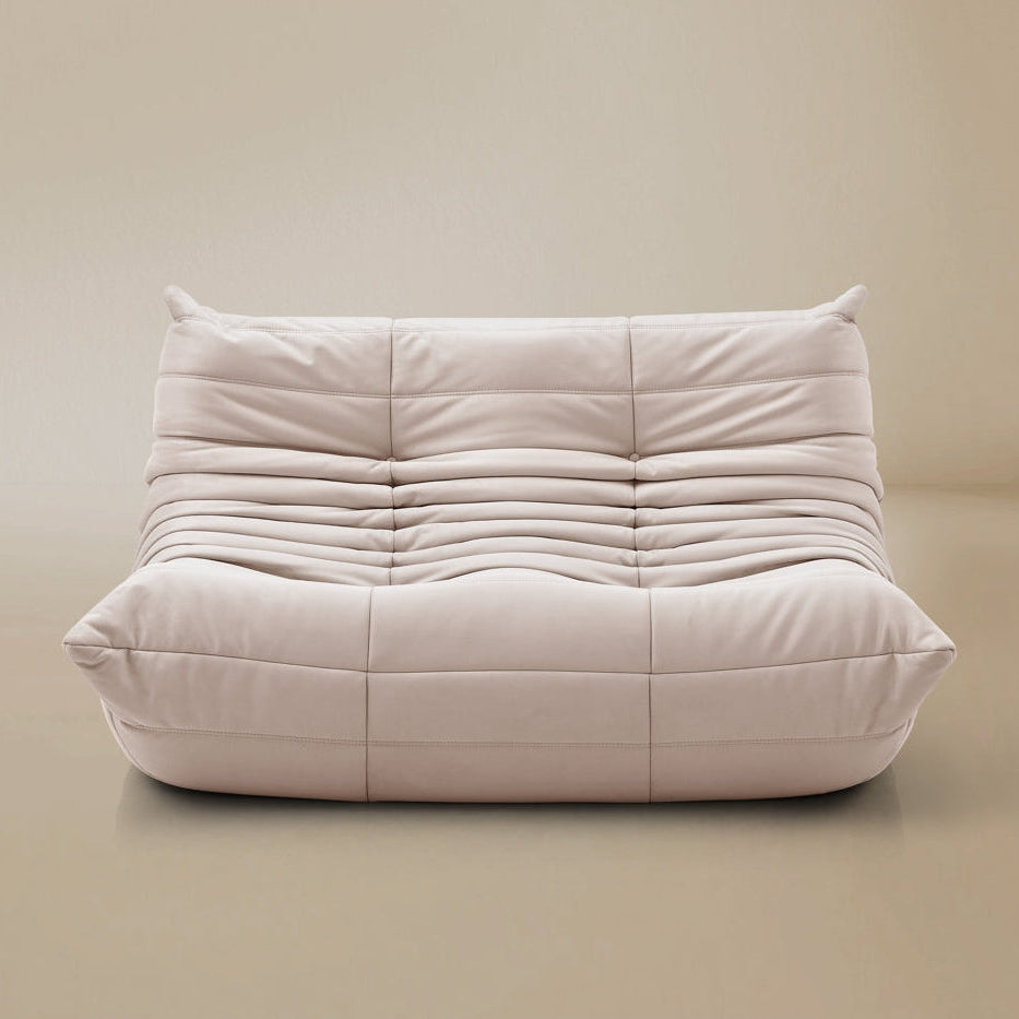 White cushioned chair on a beige background