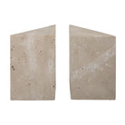Side view of the travertine bookends showing the solid triangular block shape and natural beige stone texture.