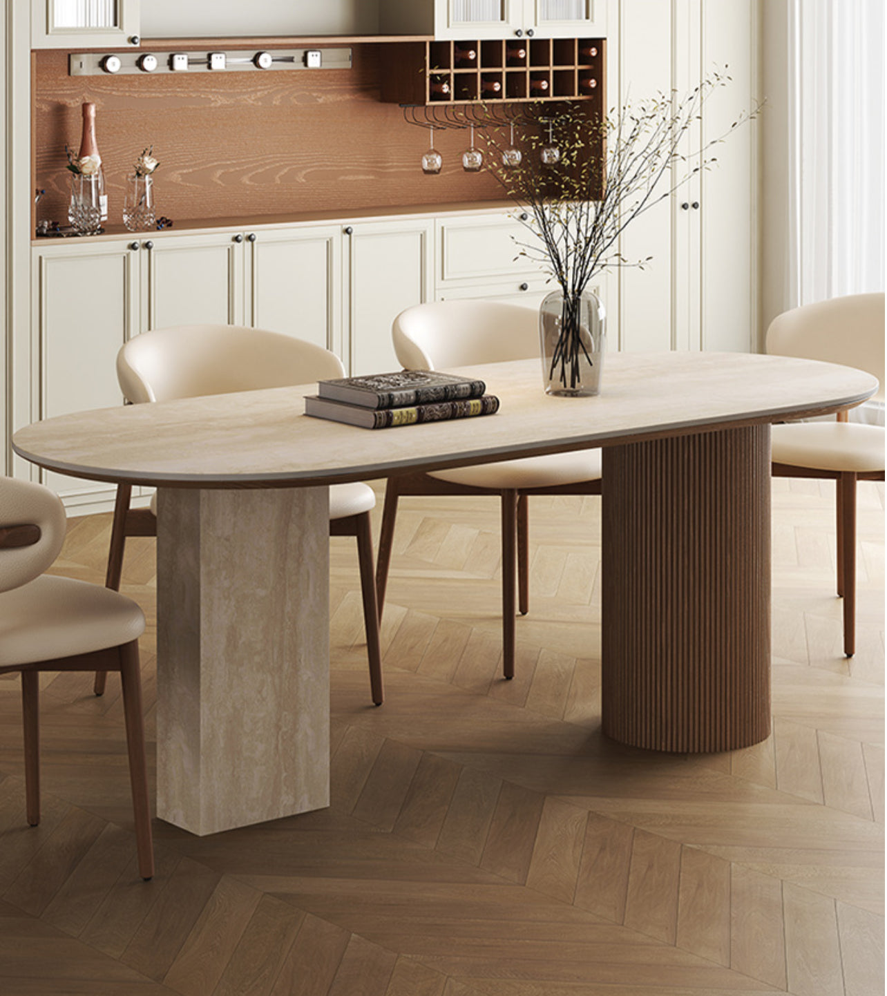 Side view of travertine sintered stone dining table with wood base and cream chairs in elegant kitchen interior