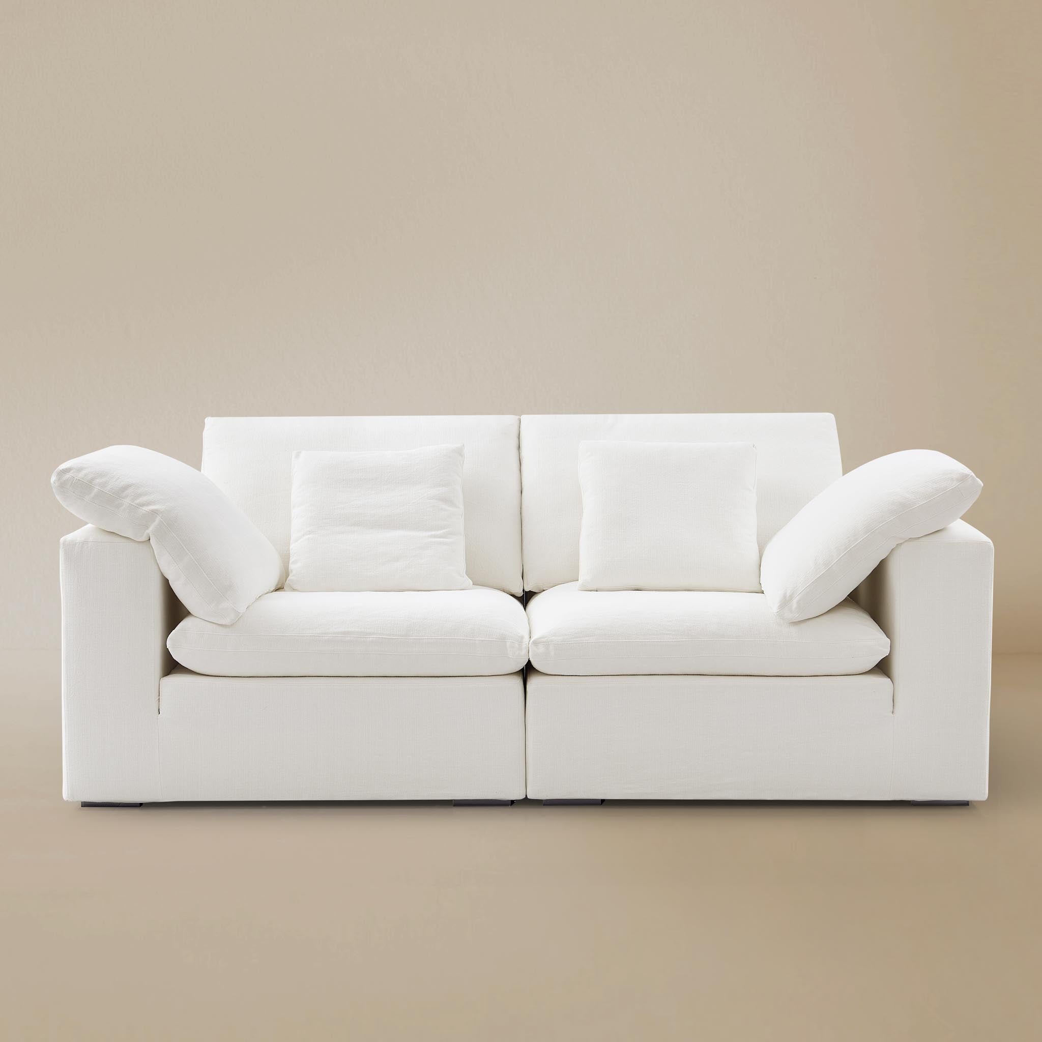 Ultra softness modular sofa two seater on a beige studio  background