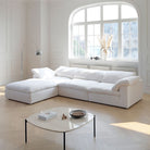 Ultra Softness Modular Cloud Sofa in natural linen with chaise lounge styled in a bright living room with large arched window