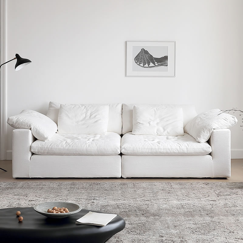 Ultra Softness Modular Cloud Sofa in natural linen with plush cushions styled in a bright modern living room with neutral decor