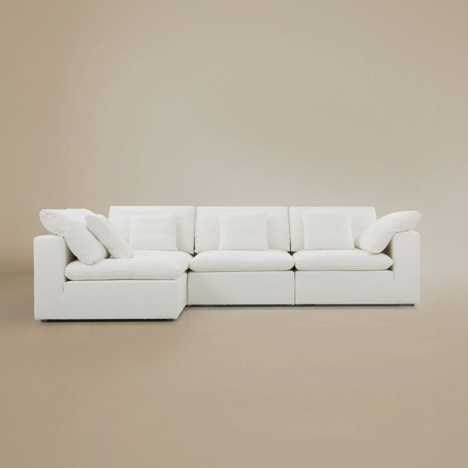 Front view of the Cloud sectional sofa on a beige studio background.