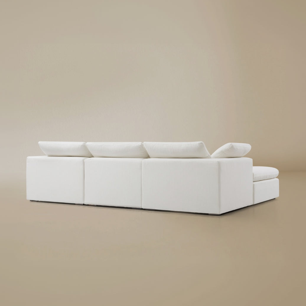 Back view of the Modular Cloud sofa on a beige background