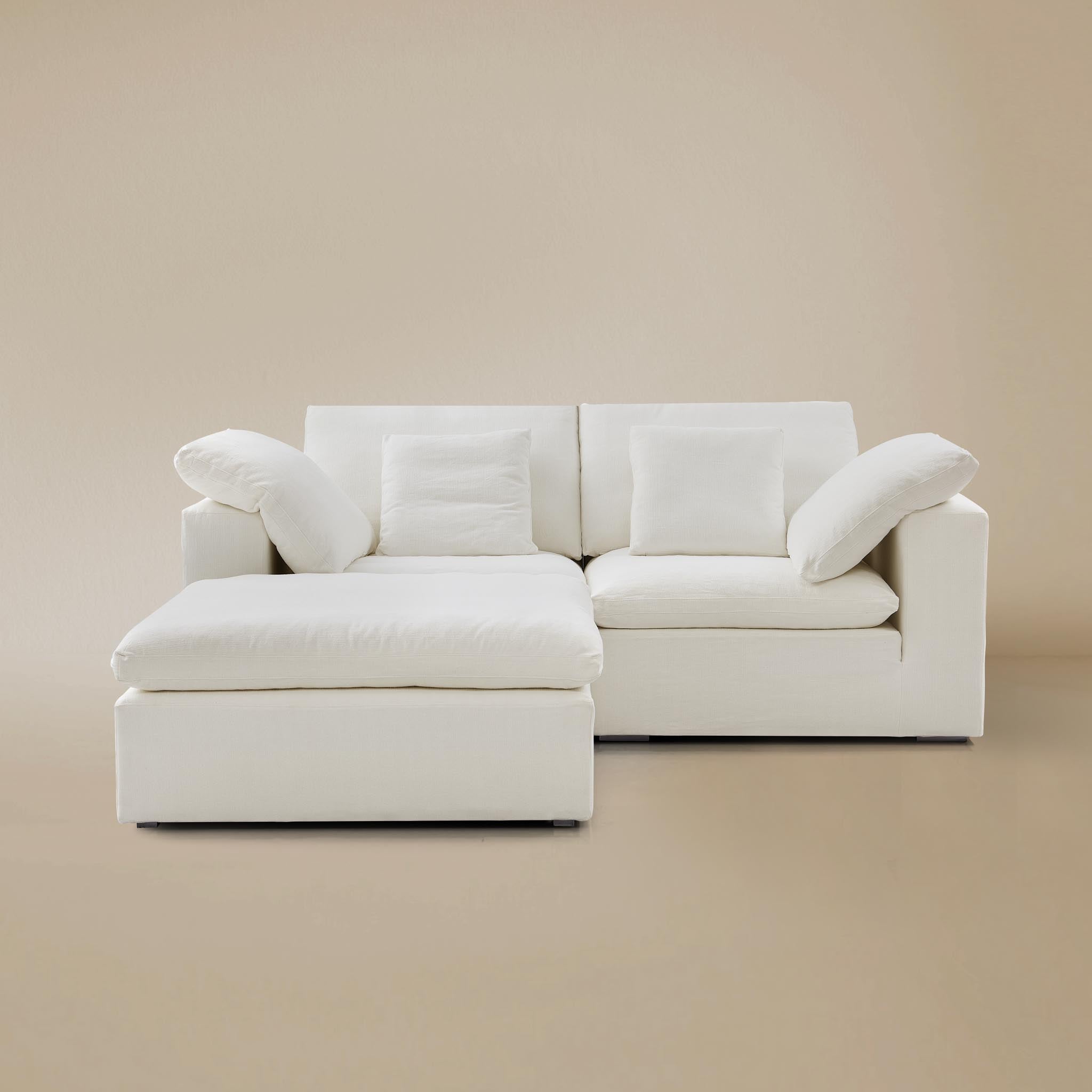 Ultra softness modular sofa two seater with ottoman on a beige studio  background