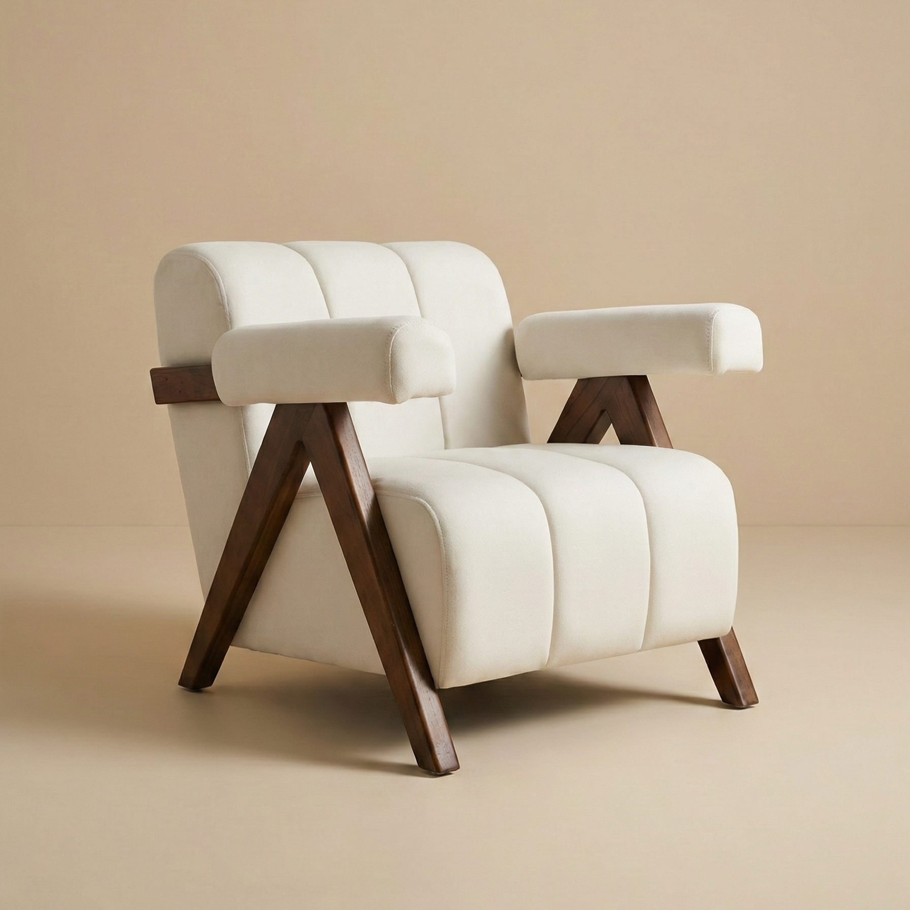 Vanguard Modern Accent Chair featuring iconic V-shaped solid wood legs and cream channel-tufted upholstery with bolster arms.