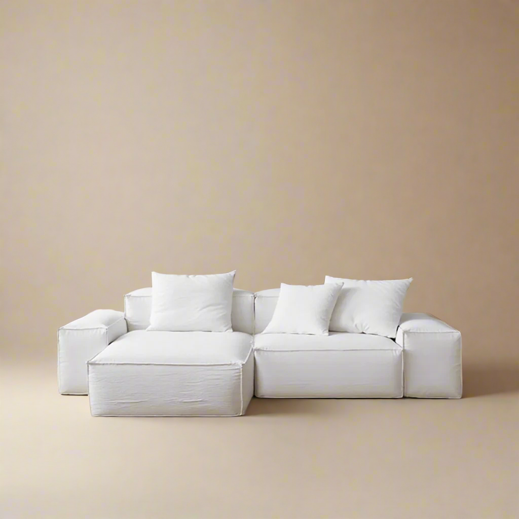 Whisper Breathable Cotton Sofa 2 seater with left chaise in soft white breathable cotton muslin fabric against beige studio background