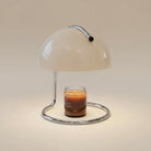 Wooden Frame Modern Candle Warmer Lamp with chrome base and dome shade warming a jar candle.